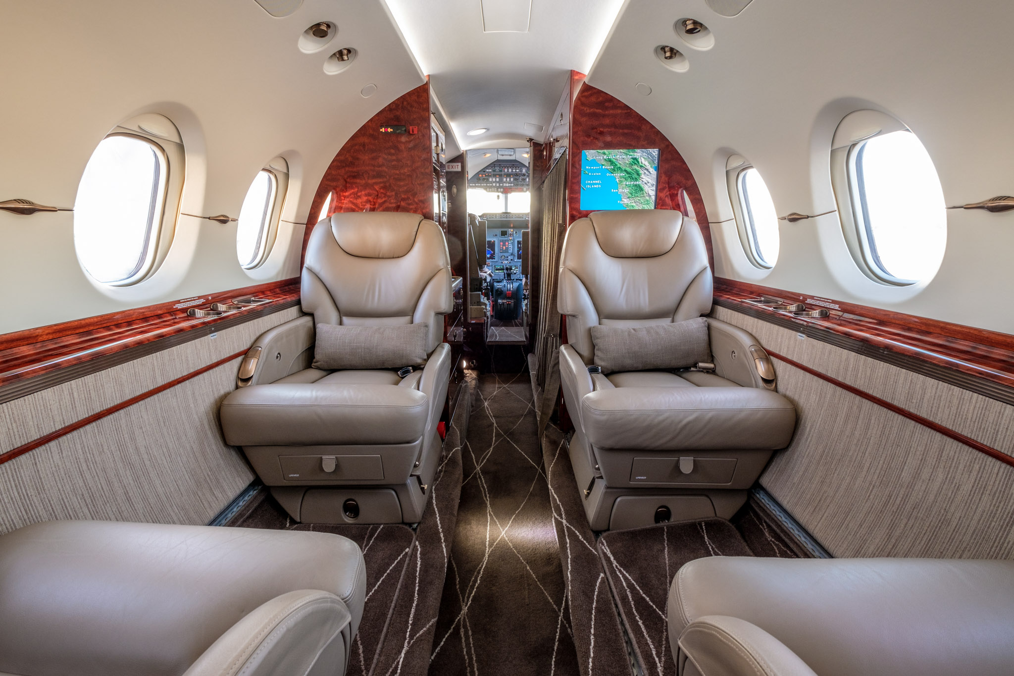 Private charter jet main cabin and cockpit