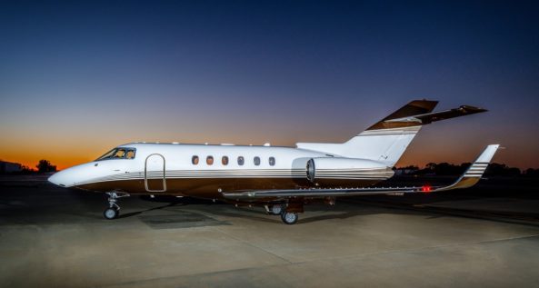 Private charter jet at dusk