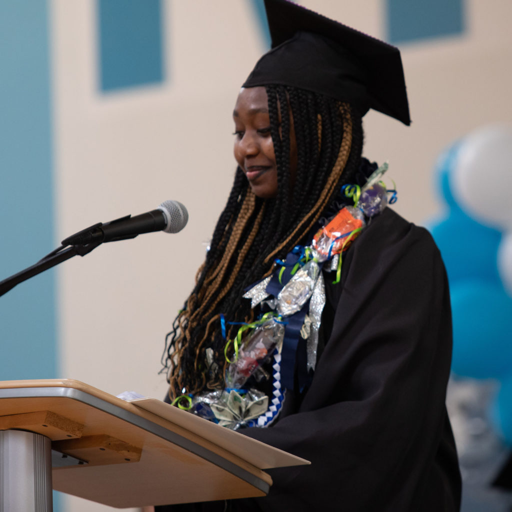 Woman giving speech at her graduation